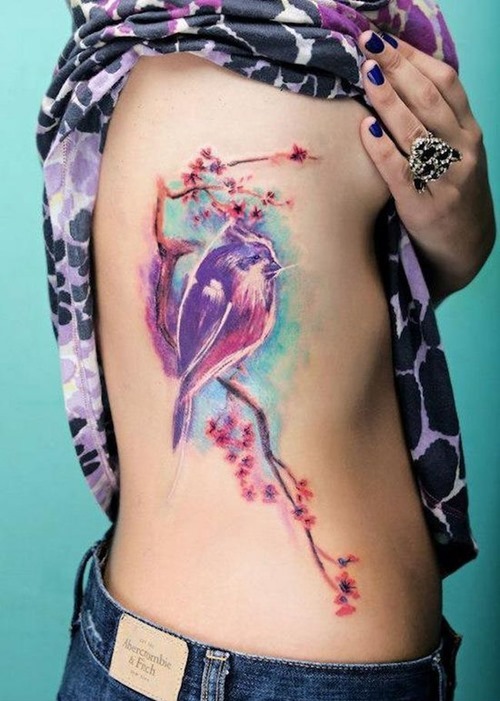 Watercolor Bird Tattoo On Girl Side Rib