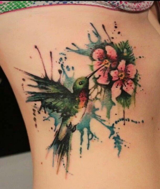 Watercolor Flying Bird With Flowers Tattoo On Side Rib