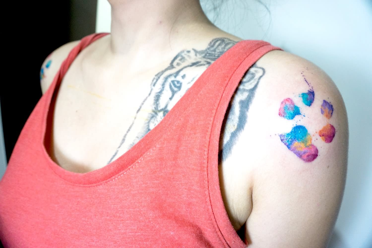 Watercolor Paw Print Tattoo On Girl Left Shoulder