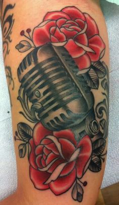 Amazing Red Rose And Microphone Tattoo On Half Sleeve