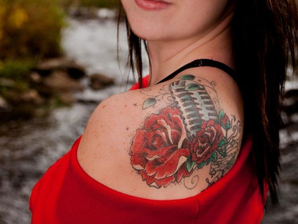 Beautiful Microphone Rose Tattoo On Left Back Shoulder