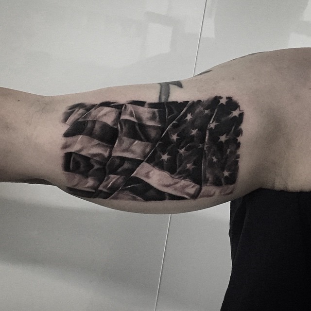 Black And Grey 3D USA Flag Tattoo On Bicep