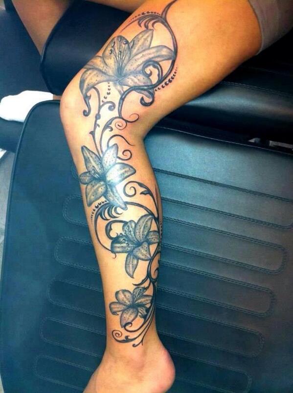 Black And Grey Flowers Tattoo On Left Leg