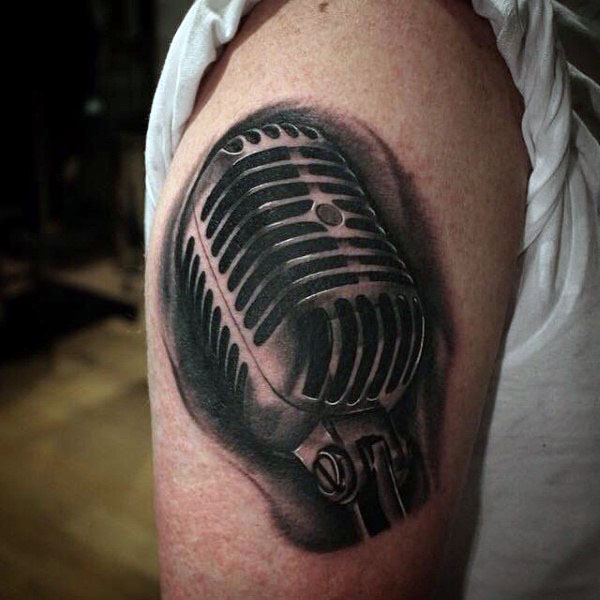 Black And Grey Microphone Tattoo On Shoulder
