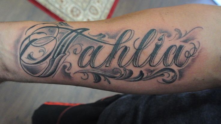 Black And Grey Tahlia Name Tattoo On Forearm
