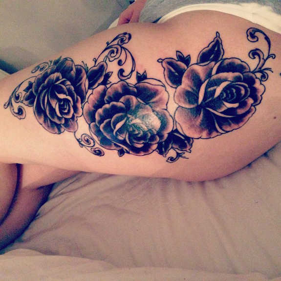 Black And Grey Tattoo On Left Thigh