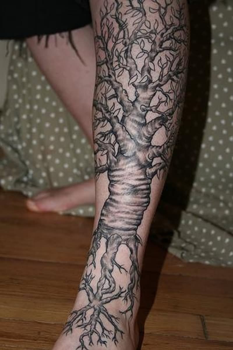 Black And Grey Tree Tattoo On Left Leg