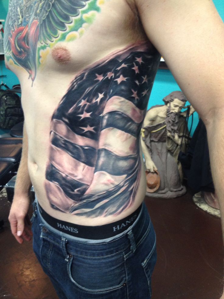 Black And Grey USA Flag Tattoo On Man Left Side Rib