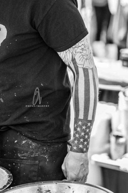 Black And White USA Flag Tattoo On Man Left Arm