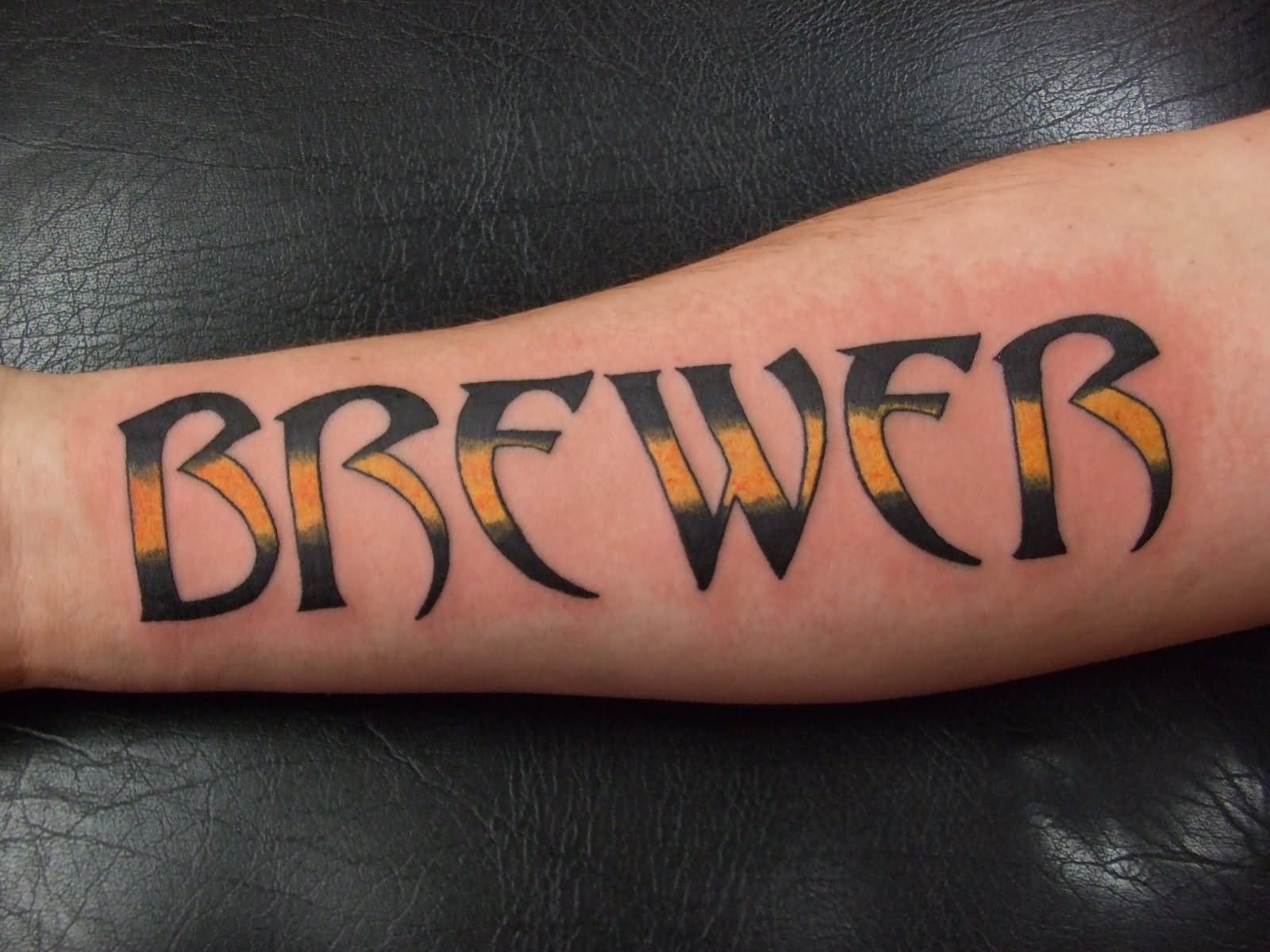 Black And Yellow Brewer Name Tattoo On Forearm