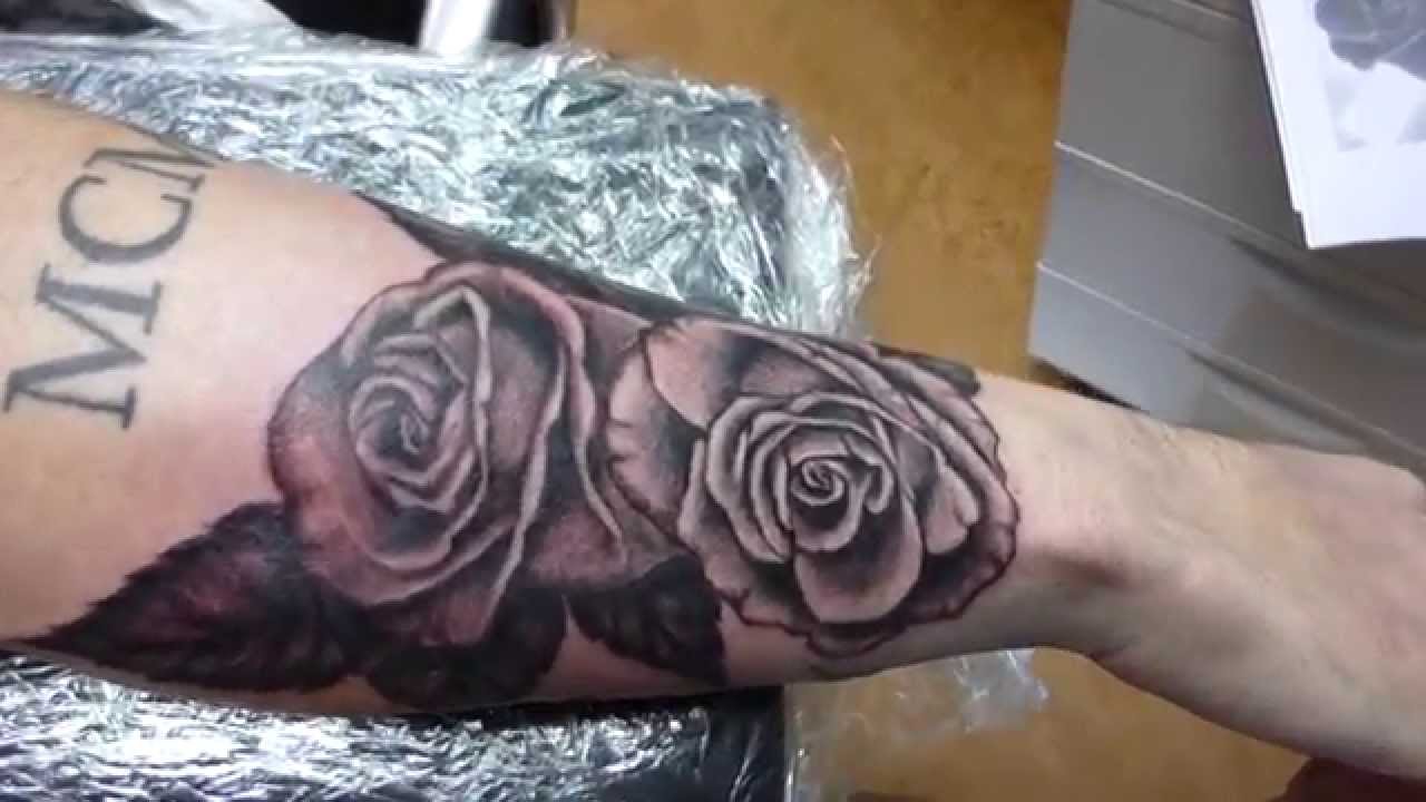 Black Ink Roses Tattoo On Forearm