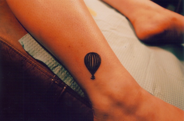 Black Ink Small Hot Balloon Tattoo On Leg