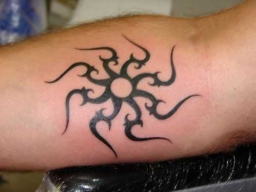 Black Tribal Sun Tattoo Design For Forearm