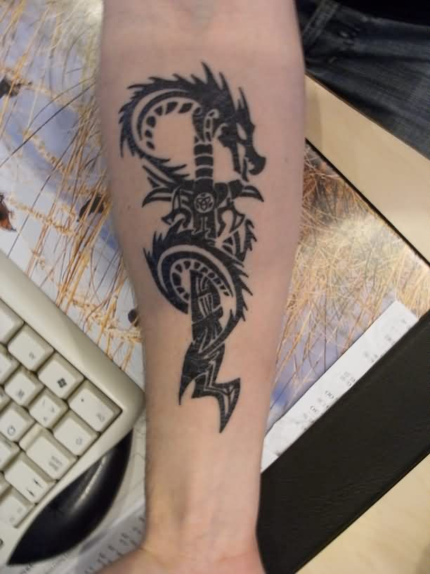 Black Tribal Sword With Dragon Tattoo On Forearm