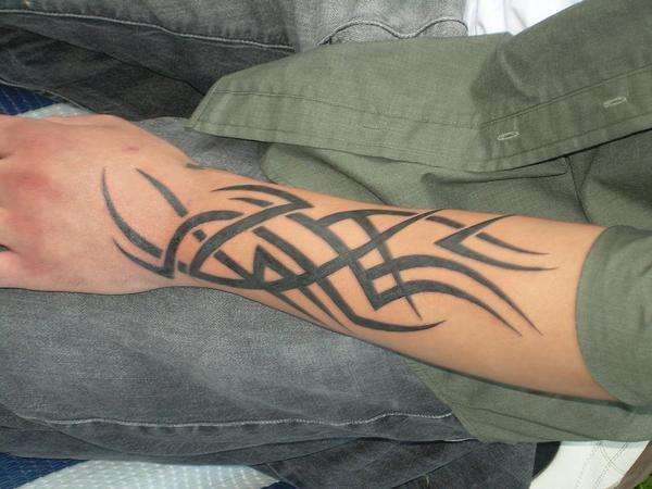 Cool Black Tribal Design Tattoo On Left Forearm