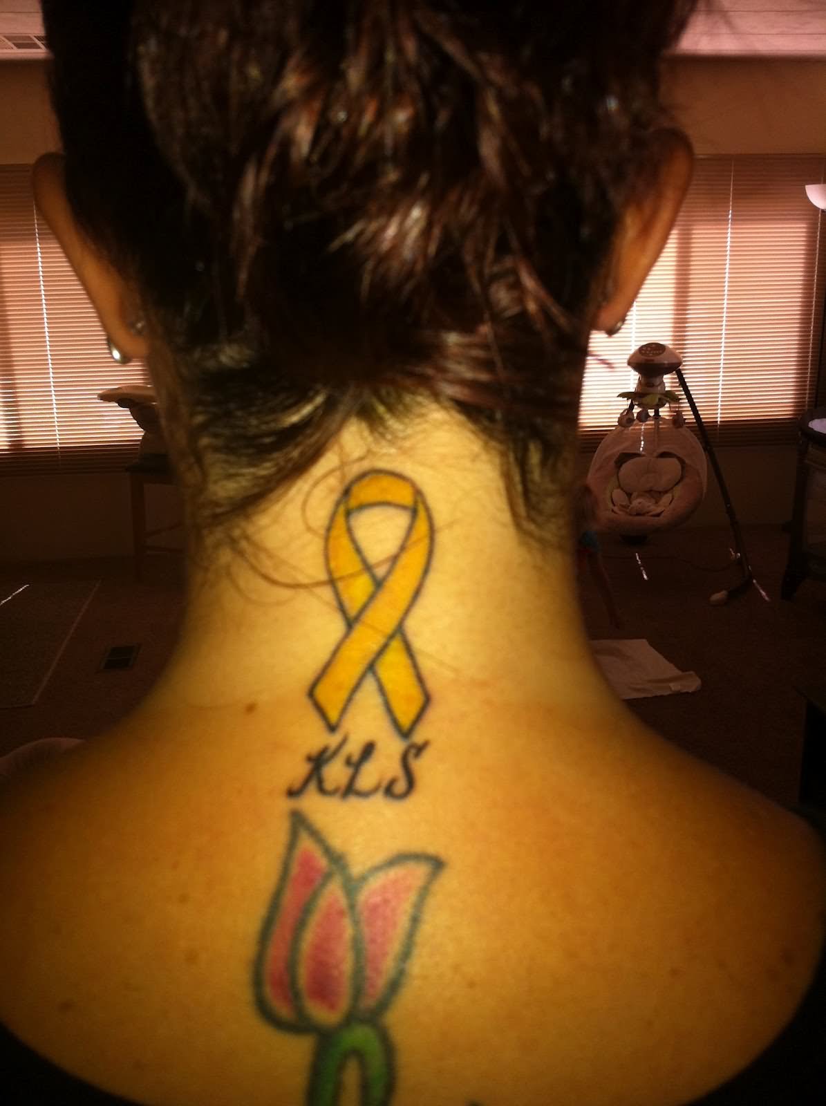 Flower And Yellow Ribbon Tattoo On Nape