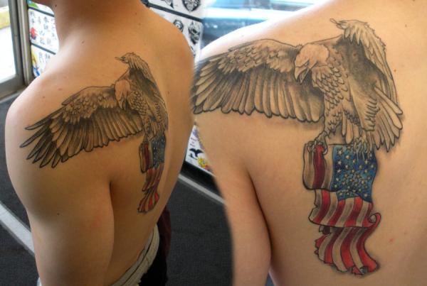 Flying Eagle With USA Flag Tattoo On Man Left Back Shoulder