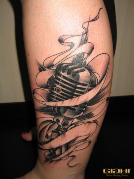 Grey Banner And Microphone Tattoo On Leg