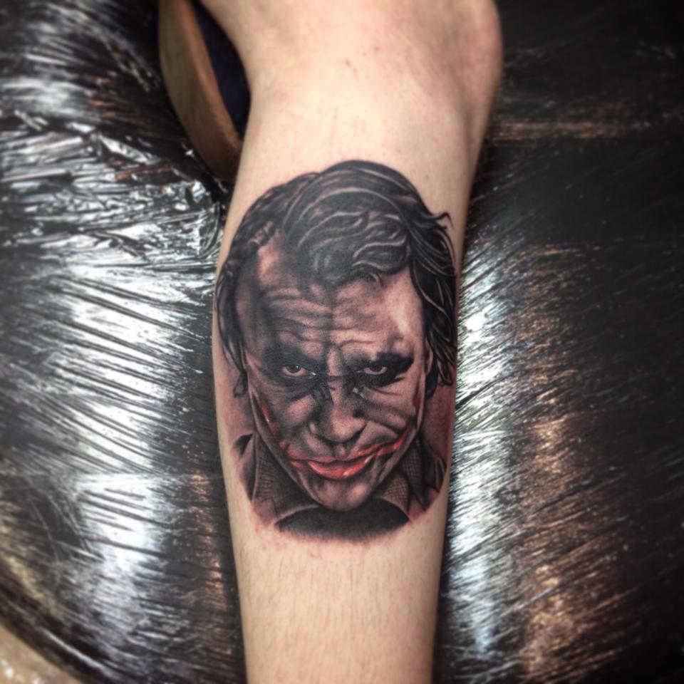 Grey Ink Joker Portrait Tattoo On Leg by Paul Priestley
