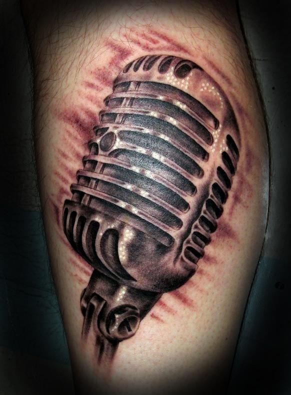 Grey Ink Microphone Tattoo On Leg