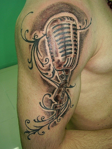 Grey Ink Microphone Tattoo On Right Shoulder