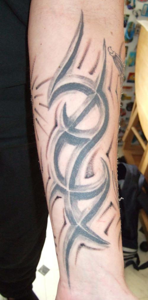Grey Ink Tribal Design Tattoo On Forearm