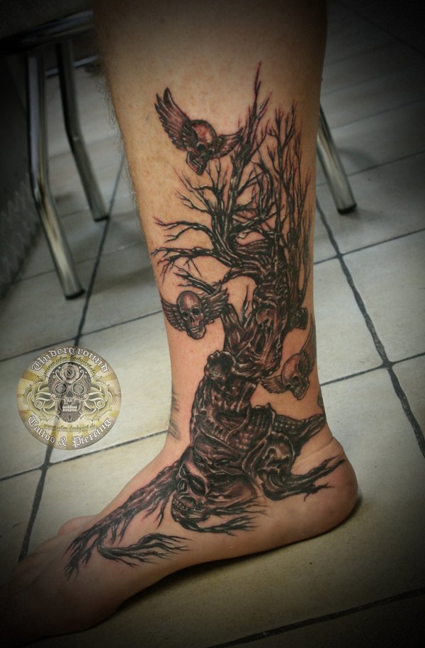 Horror Tree And Skulls With Wings Tattoo On Leg