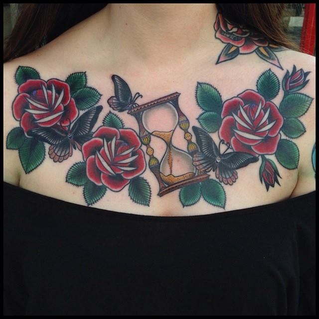 Hourglass And Rose Flowers Tattoos On Girl Chest