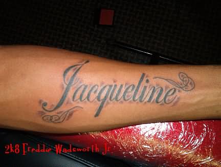 Jacqueline Name Tattoo On Left Forearm