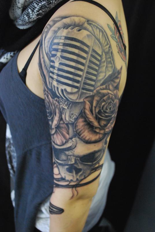 Left Half Sleeve Grey Ink Microphone Tattoo