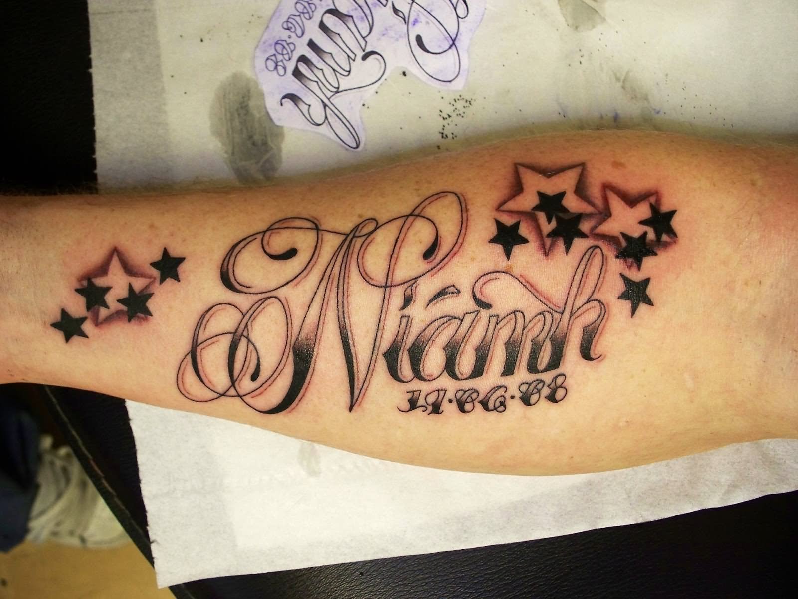 Memorial Niamh Name With Stars Tattoo On Right Forearm
