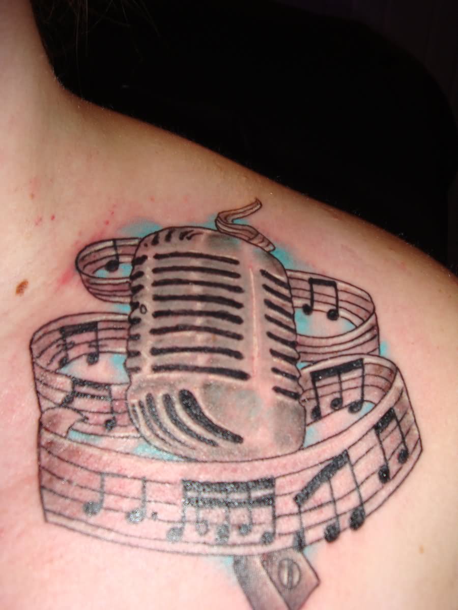 Music Notes And Microphone Tattoo On Collar Bone