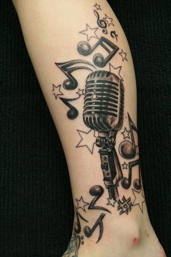 Music Notes And Microphone Tattoo On Leg