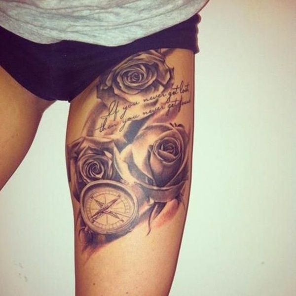 Nautical Compass And Flowers Tattoo On Thigh