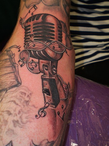 Nice Grey Microphone Tattoo On Arm
