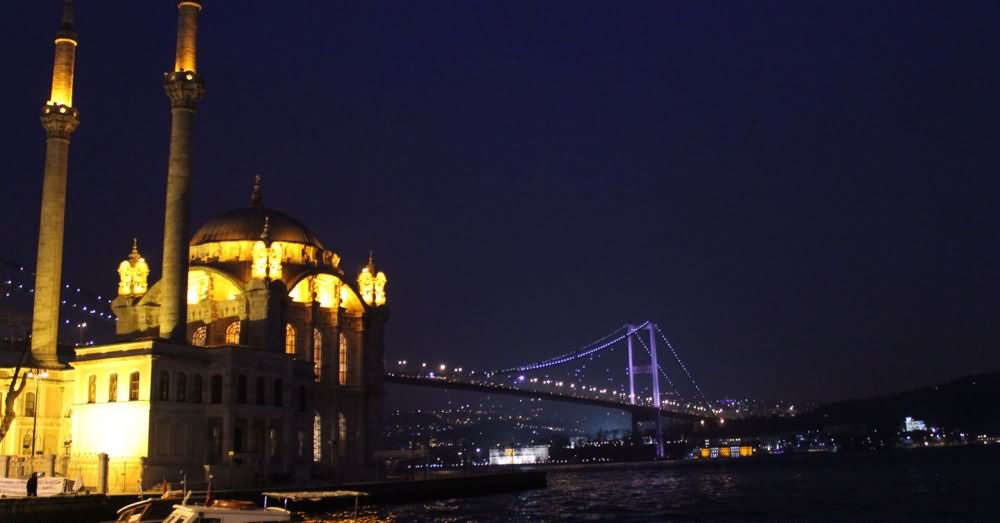 Ortakoy Mosque In Front Of The Bosphorus Bridge At Night