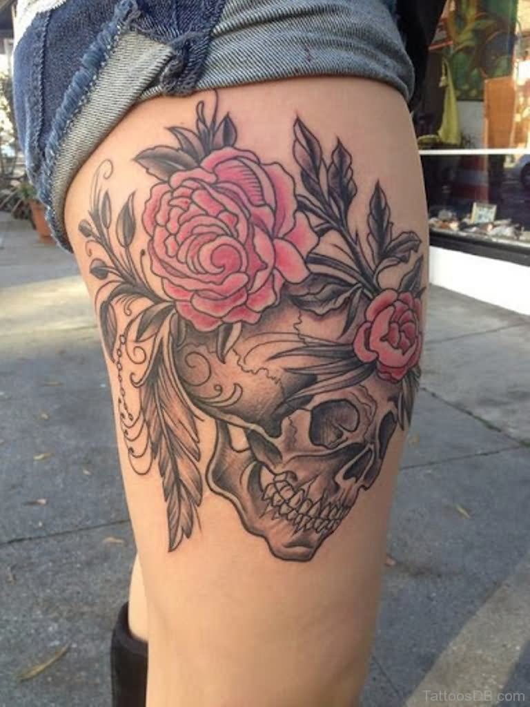 Pink Flowers And Skull Tattoo On Thigh