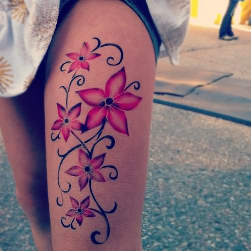 Pink Ink Flowers Tattoo On Girl Left Upper Leg