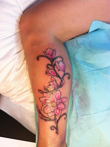 Pink Ink Flowers Tattoo On Left Leg Calf