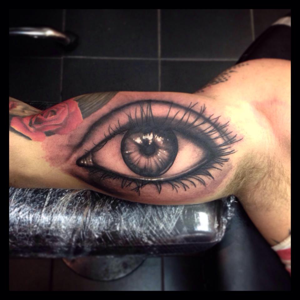 Realistic Eye Tattoo On Muscles by Paul Priestley