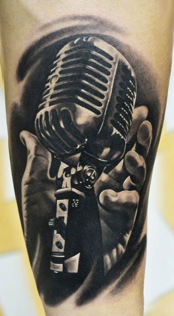Realistic Microphone In Hand Tattoo
