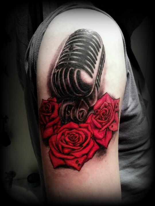 Red Roses And Microphone Tattoo On Shoulder