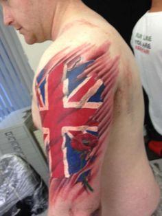 Ripped Skin UK Flag Tattoo On Man Left Half Sleeve