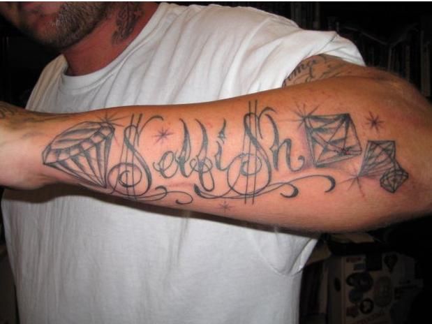Selfish Name With Diamond Tattoo On Man Left Forearm