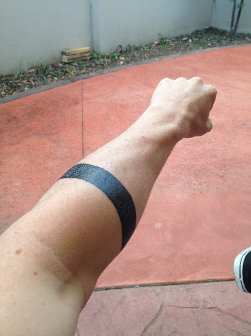 Simple Black Solid Armband Tattoo On Left Forearm