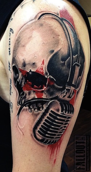 Skull And Microphone Tattoo On Left Shoulder