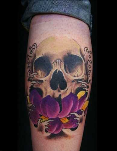 Skull With Flower Tattoo On Leg Calf