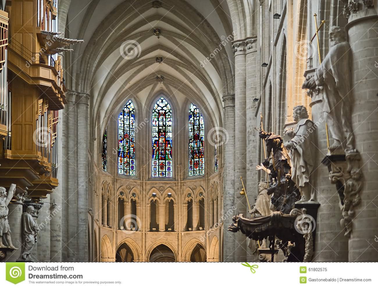 Statues On The Columns And Stained Glass Windows Inside The Cathedral of St. Michael and St. Gudula