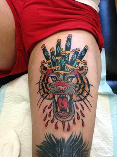 Traditional Daggers On Tiger Head Tattoo On Upper Leg By Heath Nock