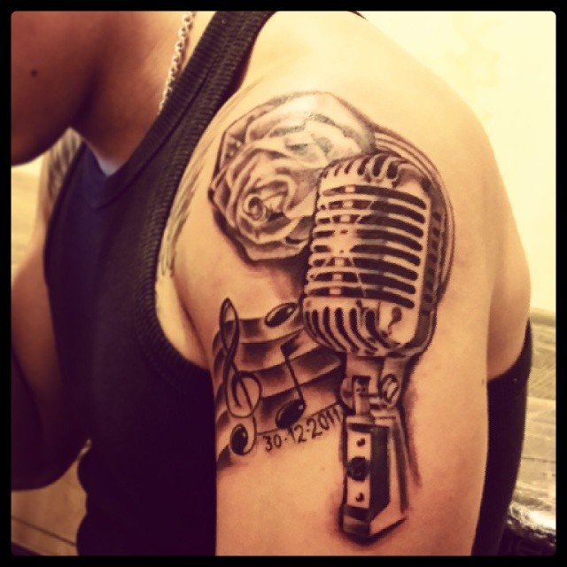 Violen Key And Microphone Tattoo On Left Shoulder